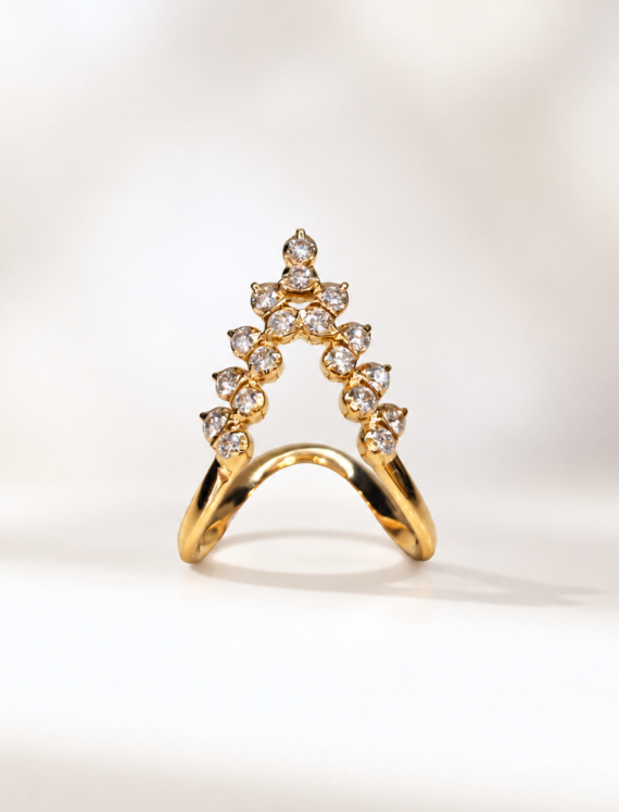Gold ring with a slender curved band and a diamond-encrusted triangular arch forming a peak at the top.