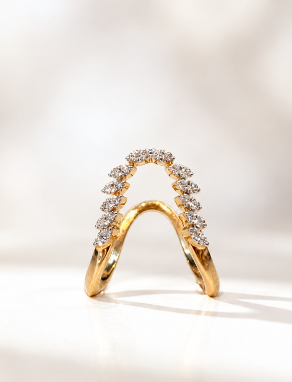 Gold ring with two bands forming a curved arch adorned with diamonds.