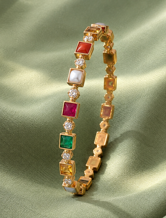 Gold bracelet with square colored gemstones and diamond accents displayed on green satin fabric.